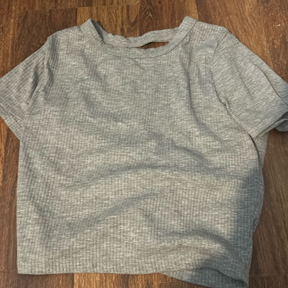 Gray t shirt with open back and ties at the bottom